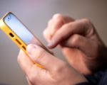 holding an iphone