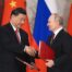 Speaking after talks with Chinese President Xi Jinping (pictured together), Putin said the move heralds the West switching to supplying Kyiv with weapons containing nuclear components, adding that Moscow will 'respond' if the UK goes ahead with its delivery of 14 next-generation battle tanks