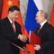 Speaking after talks with Chinese President Xi Jinping (pictured together), Putin said the move heralds the West switching to supplying Kyiv with weapons containing nuclear components, adding that Moscow will 'respond' if the UK goes ahead with its delivery of 14 next-generation battle tanks