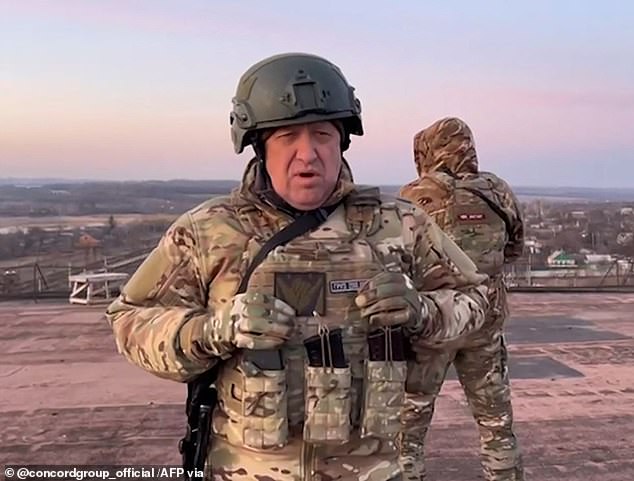 The head of Russia's Wagner mercenary group Yevgeny Prigozhin (pictured) said Friday his forces had 'practically encircled' Bakhmut, an industrial city in eastern Ukraine that has seen the fiercest fighting of Moscow's invasion