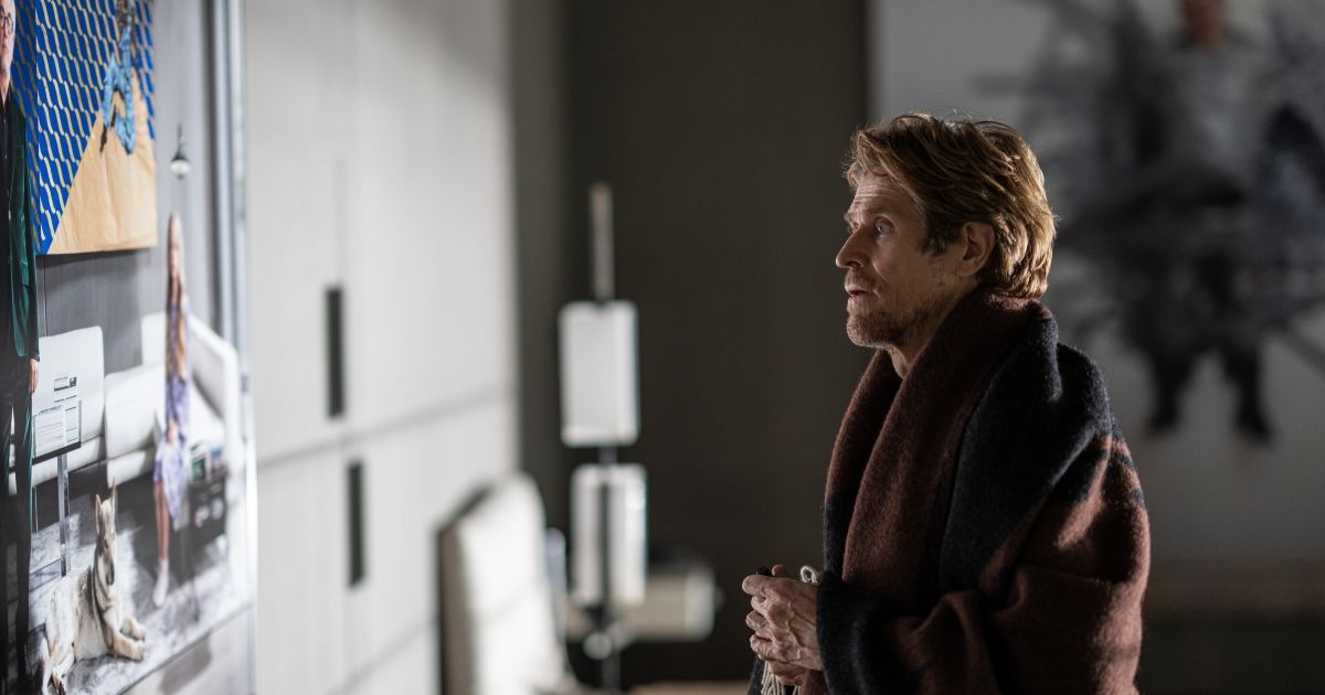 Willem Dafoe looks at art in the movie Inside 2023