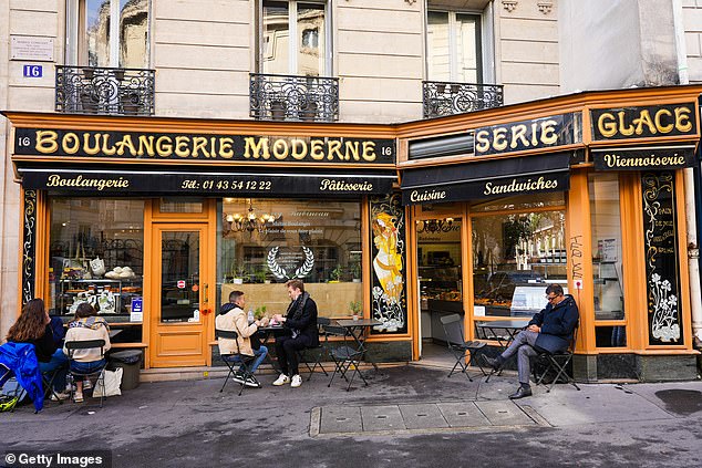 Pictured: People dining outside La Boulangerie Moderne. The 19th-century bakery, located in the 5th arrondissement, sees 40 per cent of its trade coming from fans of the show