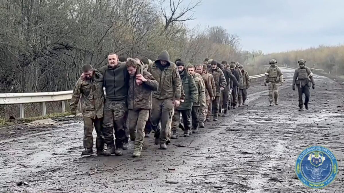 Over 100 Ukrainian troops walk muddy road to freedom after prisoner exchange with Vladimir Putin’s forces