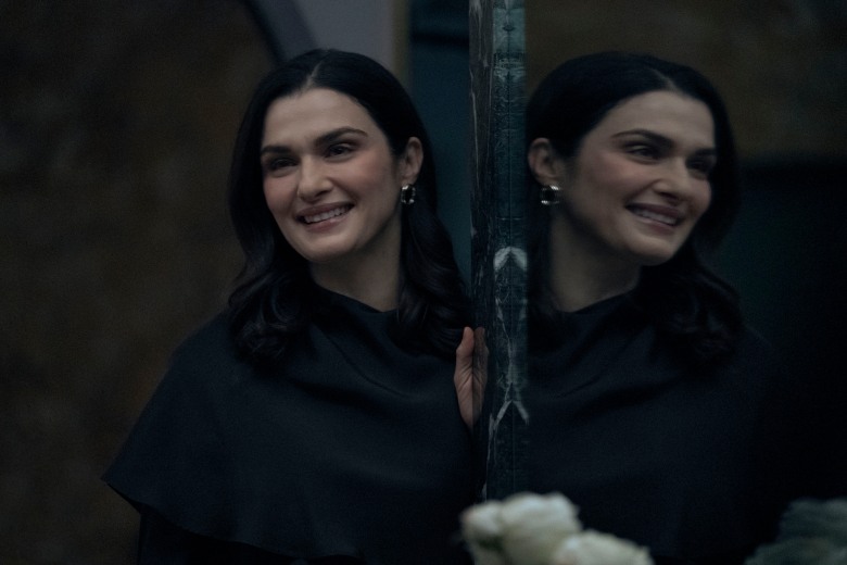 Rachel Weisz as Elliott Mantle, smiling with a mirror opposite her so that it looks like her reflection is standing right next to her, in "Dead Ringers."