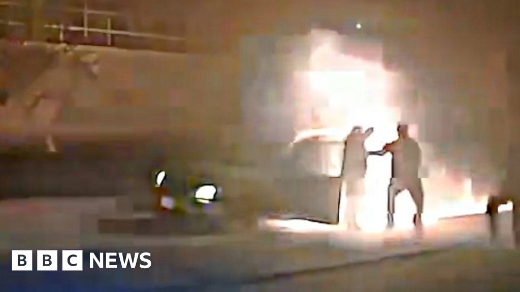 Watch US police officers save 84-year-old from burning car