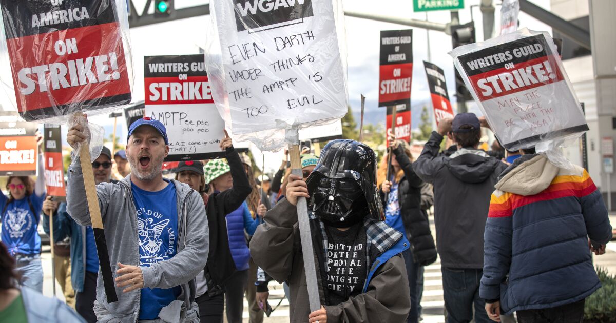 Baby Yoda marches next to Darth Vader amid writers' strike