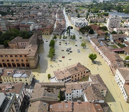 An aerial view shows partially submerged cars at a flooded area following the overflowing of a river, in the center of Lugo, near Ravenna, Italy on Thursday