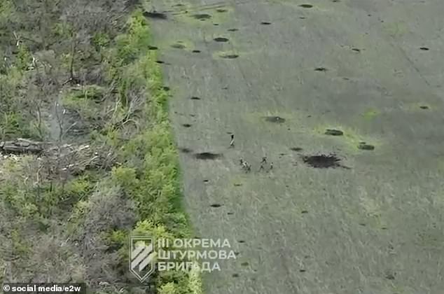 Russian forces made a humiliating retreat on Tuesday in the battle for Bakhmut, according to this dramatic aerial footage, on the same day Putin was forced to scale back his annual military parade due to his army's devastating losses