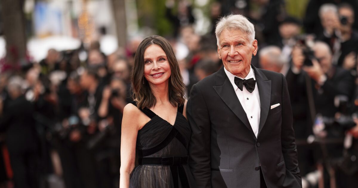 Harrison Ford sneaks peek at Calista Flockhart in Cannes