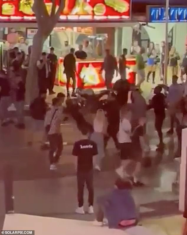 Magaluf mega-brawl: More than FIFTY people are filmed fighting and throwing bottles in huge punch-up