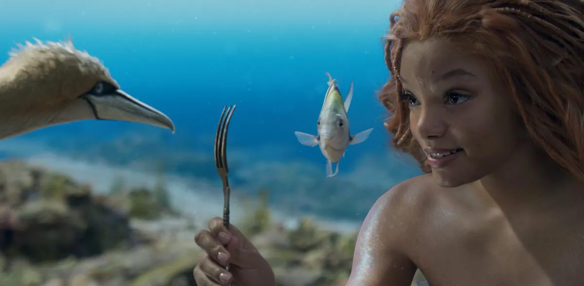 Scuttle (voiced by Awkwafina), Flounder (voiced by Jacob Tremblay) and Halle Bailey as Ariel in Disney's live-action “The Little Mermaid.”