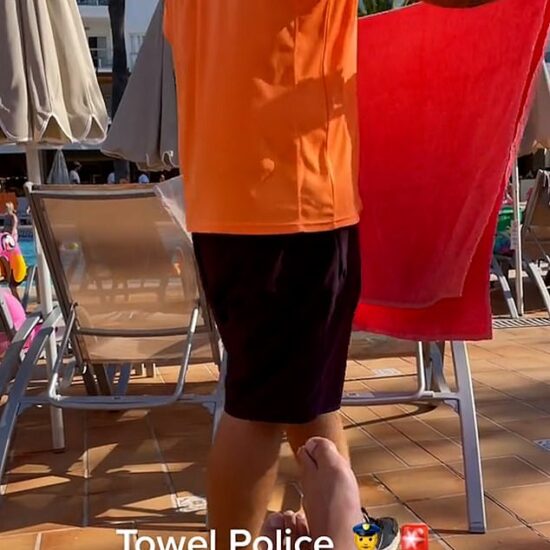 The 'towel policeman' can be seen shoving all the holidaymakers' belongings into plastic bags