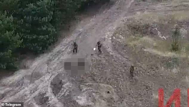 A shocking video has shown Russian barrier troops appearing to shoot their fellow soldiers as they attempt to flee the field of battle