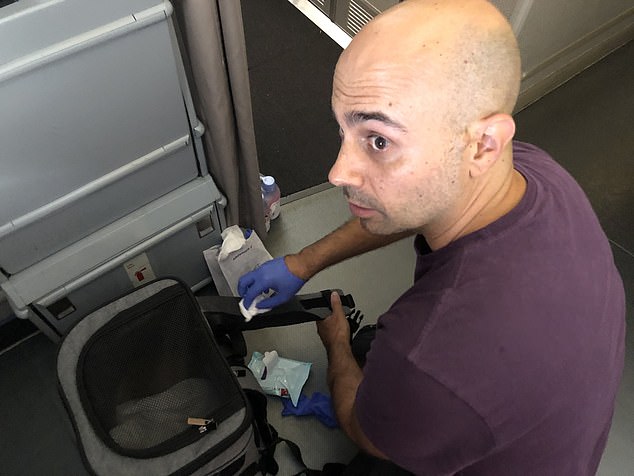 Habib Battah and his wife were flying with their two cats in the footwell. When he noticed that the stains had soaked through to the container he used a whole pack of wet wipes to clean it