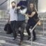 Josh James Menkens (centre) was pictured today being taken from a courthouse in the city of Leiria, an hour's drive away from the commune after being quizzed by a judge investigating the case