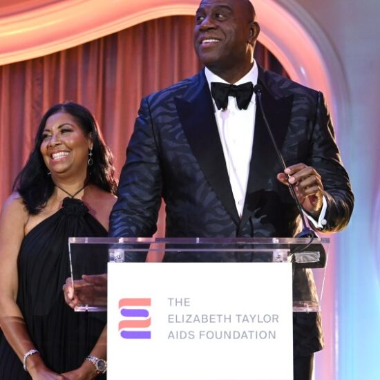BEVERLY HILLS, CALIFORNIA - SEPTEMBER 21: (L-R) Cookie Johnson and Magic Johnson speak onstage during the Elizabeth Taylor Ball to End AIDS at The Beverly Hills Hotel on September 21, 2023 in Beverly Hills, California. (Photo by Jon Kopaloff/Getty Images for The Elizabeth Taylor AIDS Foundation)