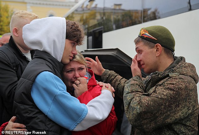 A Russian reservist bids farewell to relatives before his departure for a base in the course of partial mobilisation of troops, in Gatchina, Russia, on October 1, 2022
