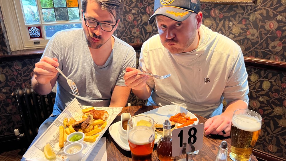 Trae Crowder and Corey Ryan Forrester sample the cuisine in the UK.
