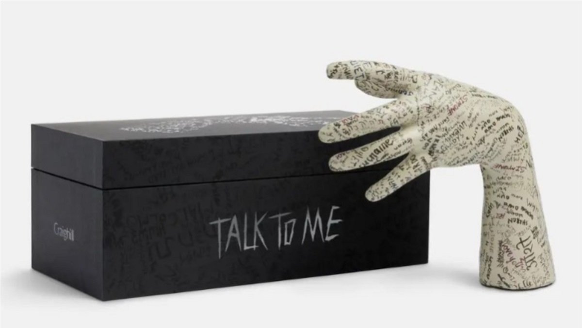 The Talk to Me party hand replica and its box from A24.