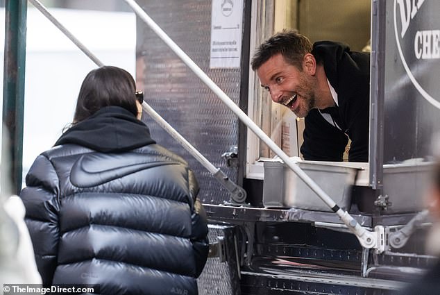 Bradley Cooper greeted by his ex Irina Shayk AND his new flame Gigi Hadid at his new business venture – a cheesesteak food truck – in NYC