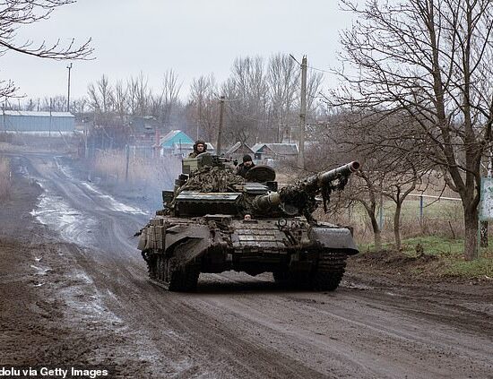 A tank T-64 drives by in Novoselivka Persha after driving out of Avdiivka, Ukraine, on December 4