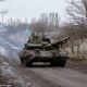 A tank T-64 drives by in Novoselivka Persha after driving out of Avdiivka, Ukraine, on December 4