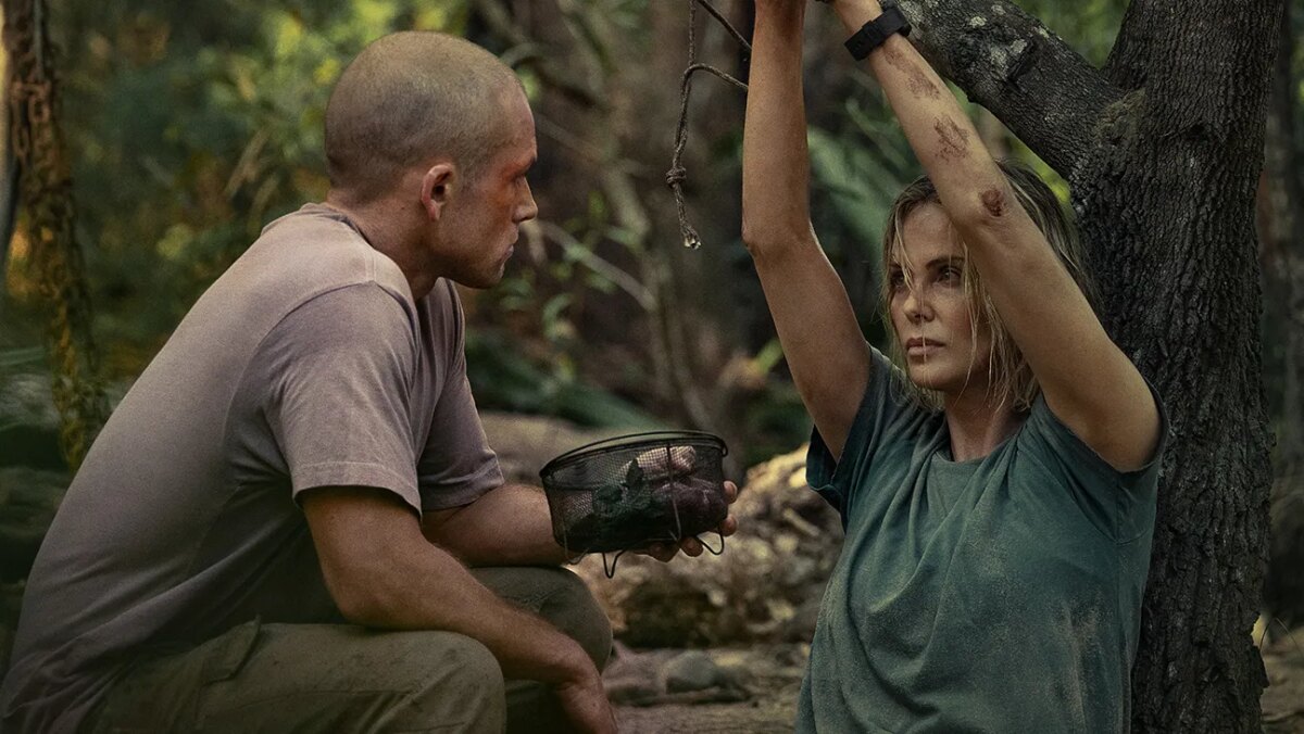 (L-R) Taron Egerton as Ben and Charlize Theron as Sasha in Apex.