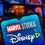 Marvel Studios and Disney Plus logos, MCU tiles in background