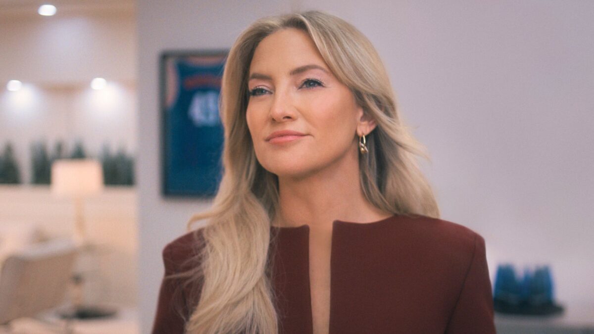 Kate Hudson looks at something offscreen