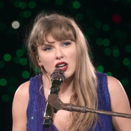 Taylor Swift sitting at the piano singing in The Eras Tour: The Final Show