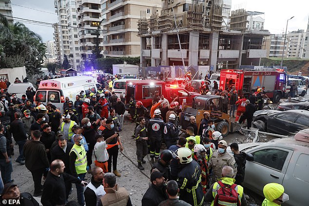epa12875791 First responders gather at the scene of a partially destroyed residential building following an Israeli air strike, in the Tallet al-Khayat neighborhood of Beirut, Lebanon, 08 April 2026. Israel launched a large-scale attack on multiple locations across Lebanon, with many hitting central Beirut one day after the United States and Iran agreed to a ceasefire to end hostilities between the two countries. In a statement, the Israeli government announced the ceasefire does not include Lebanon and they will continue to strike Hezbollah locations throughout the country.  EPA/WAEL HAMZEH