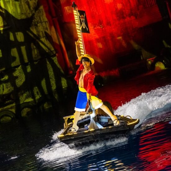 Luffy from One Piece riding on a boat during Universal Fan Fest's Grand Pirate Show