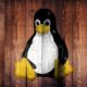 Linux penguin logo on wood