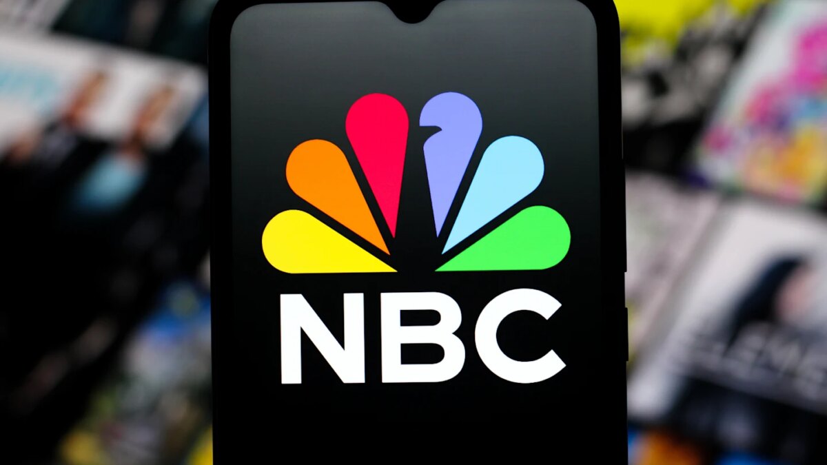 In this photo illustration, the NBC (National Broadcasting Company) logo is seen displayed on a smartphone screen.