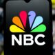 In this photo illustration, the NBC (National Broadcasting Company) logo is seen displayed on a smartphone screen.