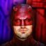 Daredevil in front of a blue and red background.