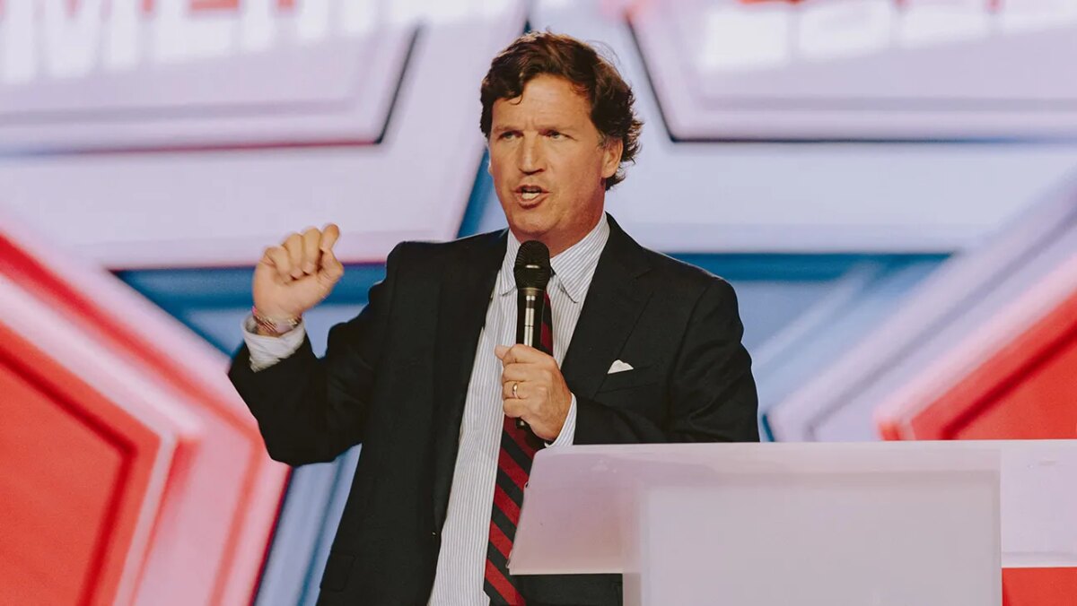 Conservative political commentator and podcast host Tucker Carlson speaks at Turning Point