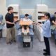 People giving blood while wearing a Samsung Galaxy XR headset