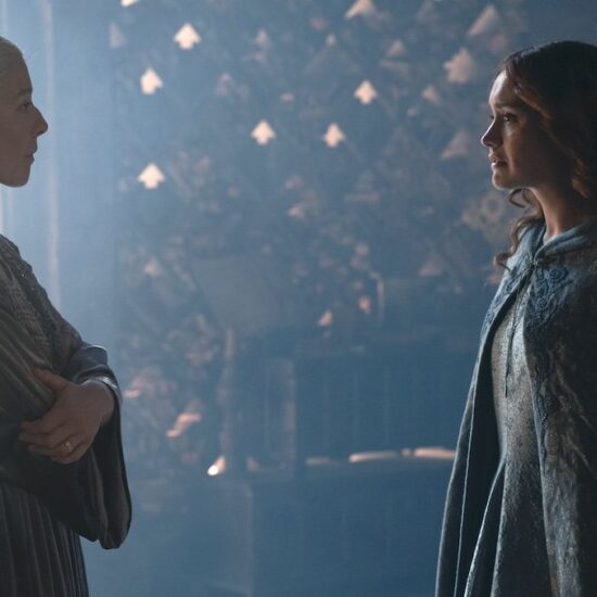 Aemond and Helaena stand together on a balcony to talk about war in house of the dragon