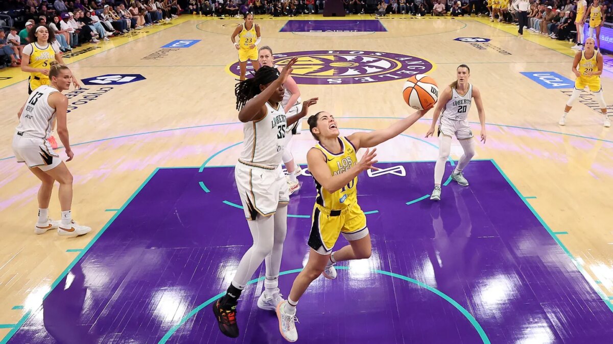 Kelsey Plum #10 of the Los Angeles Sparks drives to the basket against Jonquel Jones #35 of the New York Liberty during the first quarter at Crypto.com Arena on Aug. 12, 2025 in Los Angeles, California.