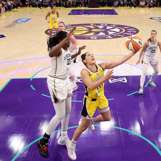 Kelsey Plum #10 of the Los Angeles Sparks drives to the basket against Jonquel Jones #35 of the New York Liberty during the first quarter at Crypto.com Arena on Aug. 12, 2025 in Los Angeles, California.