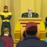 Jean Grey, Cyclops, Professor X, and Beast at a press conference.