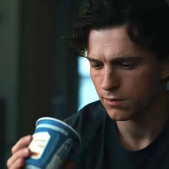 Peter Parker sadly looks at a Greek coffee cup in Spider-man : brand new day