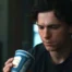 Peter Parker sadly looks at a Greek coffee cup in Spider-man : brand new day