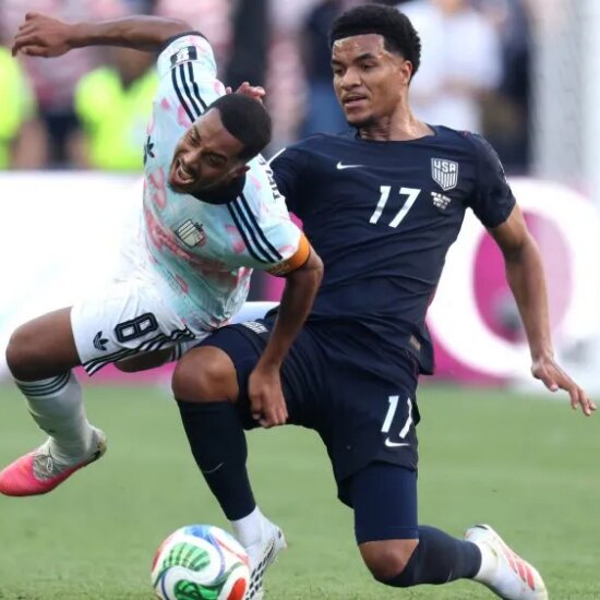 SEATTLE, WASHINGTON - JULY 06: Youri Tielemans #8 of Belgium is fouled by Malik Tillman #17 of the United States resulting in a yellow card during the FIFA World Cup 2026 Round of 16 match between USA and Belgium at Seattle Stadium on July 06, 2026 in Seattle, Washington. (Photo by Jamie Squire/Getty Images)