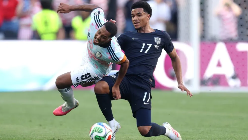 SEATTLE, WASHINGTON - JULY 06: Youri Tielemans #8 of Belgium is fouled by Malik Tillman #17 of the United States resulting in a yellow card during the FIFA World Cup 2026 Round of 16 match between USA and Belgium at Seattle Stadium on July 06, 2026 in Seattle, Washington. (Photo by Jamie Squire/Getty Images)