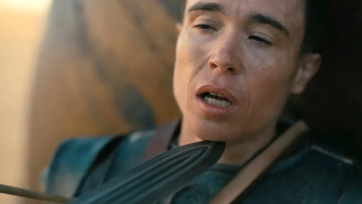 Nearly unconscious Elliot Page with a sword holding up his chin in The Odyssey