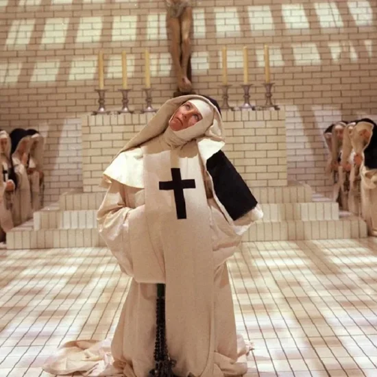 Sister Jeanne (Vanessa Redgrave) kneels amid other nuns and a crucifix in Ken Russell