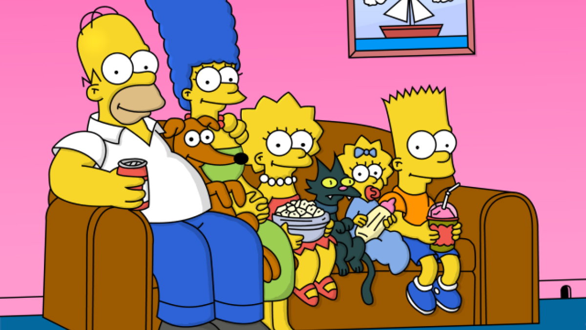 The Simpsons on their couch smiling