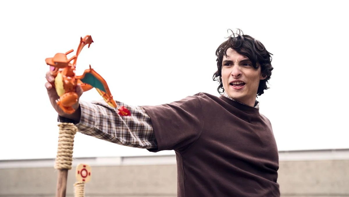 A still of Finn Wolfhard from the new LEGO Pokemon collaboration ad with Terry Crews.